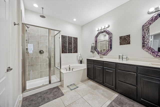 7917 Parkwood Blvd, Plano, TX 75024 - bathroom with a stall shower, a garden tub, double vanity, tile patterned flooring, and recessed lighting