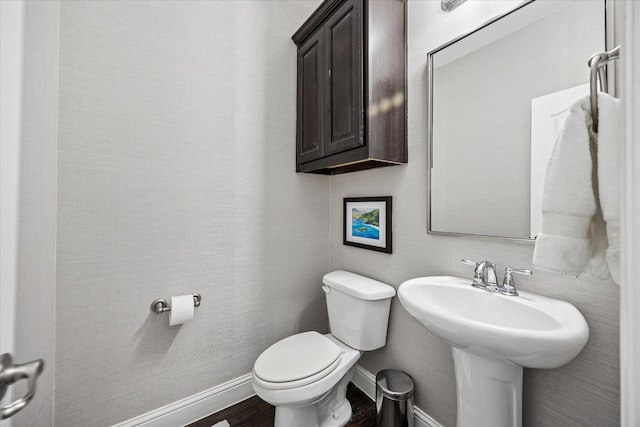 7917 Parkwood Blvd, Plano, TX 75024 - bathroom featuring baseboards, toilet, and wood finished floors