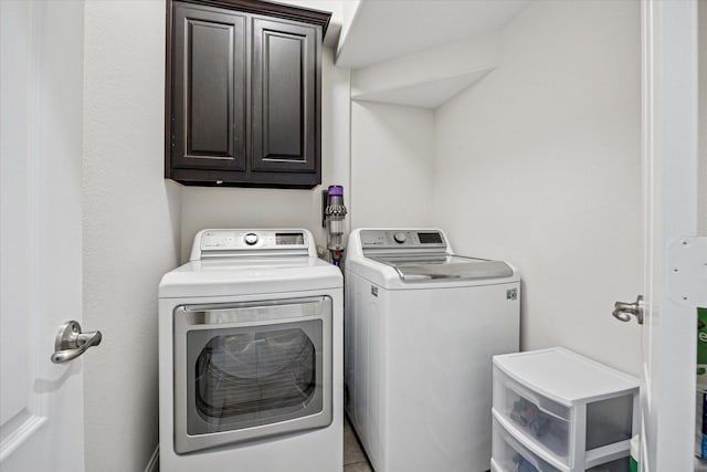 7917 Parkwood Blvd, Plano, TX 75024 - laundry area featuring washer and dryer and cabinet space