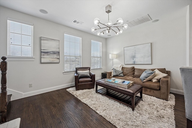 7917 Parkwood Blvd, Plano, TX 75024 - living room featuring a chandelier, dark wood-style floors, and baseboards