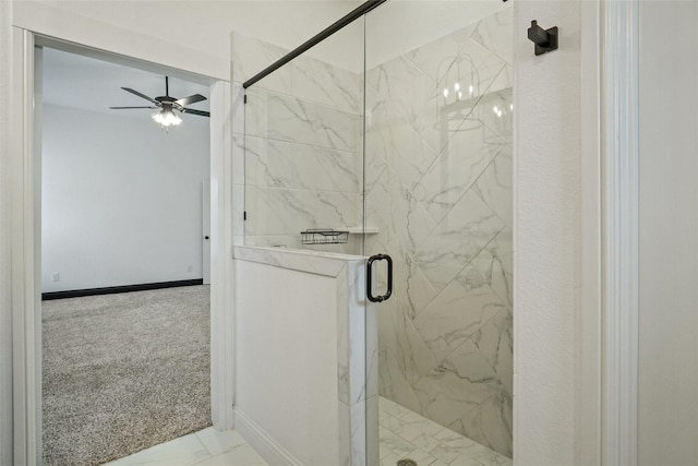 full bathroom featuring a marble finish shower, baseboards, marble finish floor, and ceiling fan