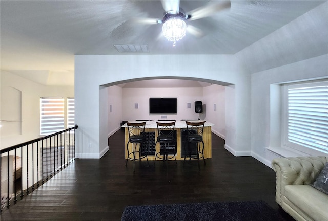 dining room with wood finished floors, visible vents, and baseboards