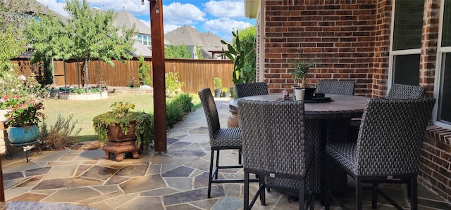 view of patio / terrace featuring outdoor dining space and fence