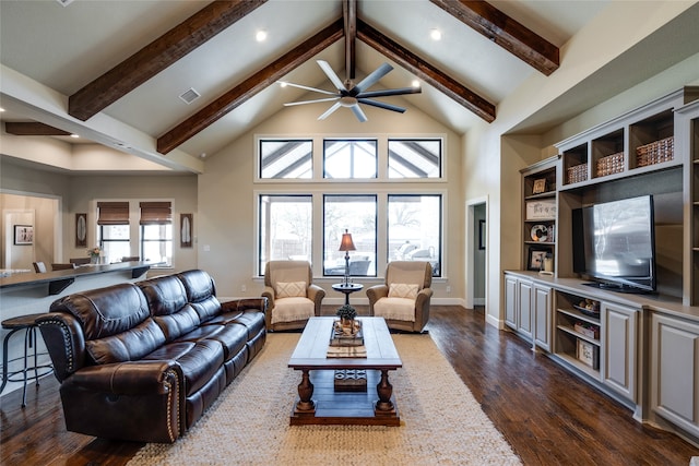 living area with beam ceiling, dark wood-style floors, visible vents, and high vaulted ceiling