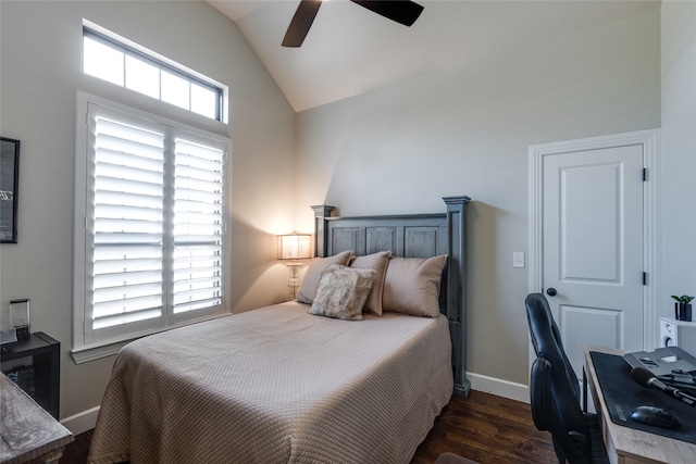 bedroom featuring vaulted ceiling, multiple windows, dark wood-style floors, and baseboards