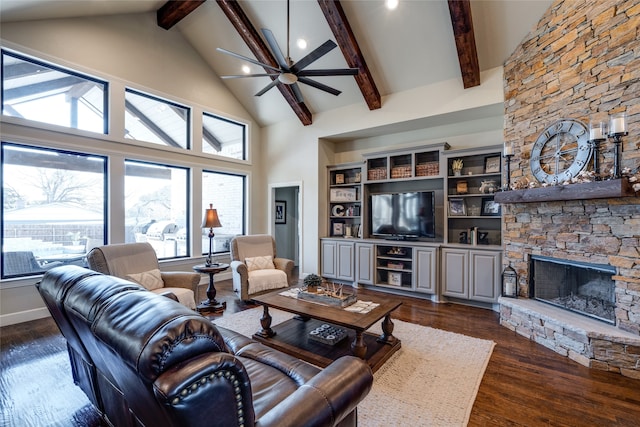 living area with high vaulted ceiling, a fireplace, ceiling fan, dark wood-type flooring, and beamed ceiling