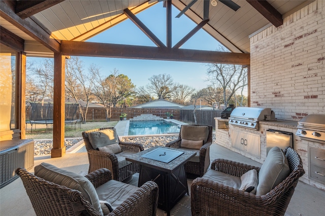 view of patio / terrace featuring area for grilling, a fenced in pool, and a trampoline