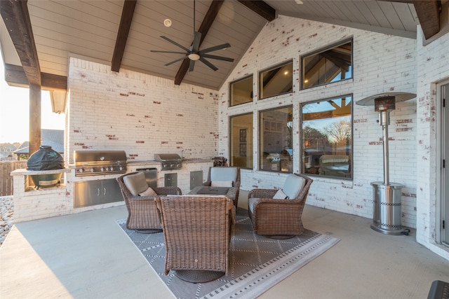 view of patio with exterior kitchen, area for grilling, an outdoor living space, and ceiling fan