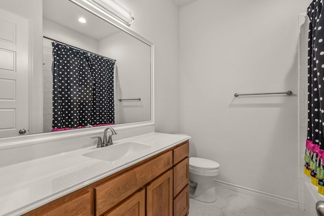 full bath with vanity, toilet, baseboards, and tile patterned flooring