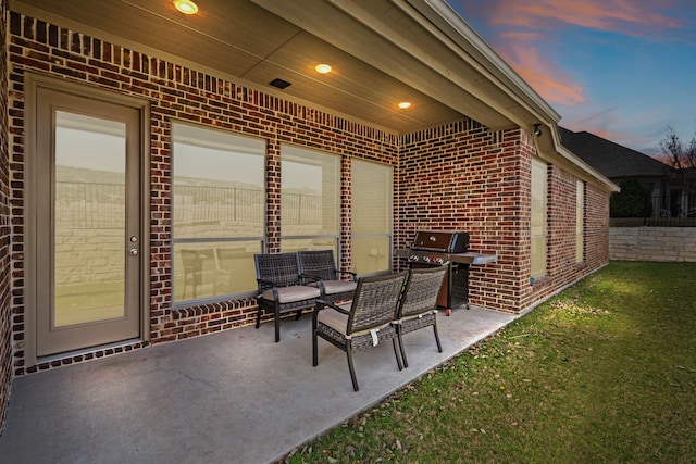 view of patio featuring a grill