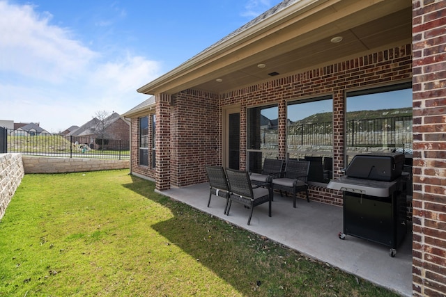 view of patio featuring area for grilling, fence, and an outdoor hangout area