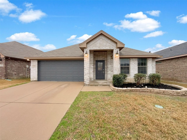 ranch-style home featuring a front lawn, roof with shingles, concrete driveway, a garage, and brick siding