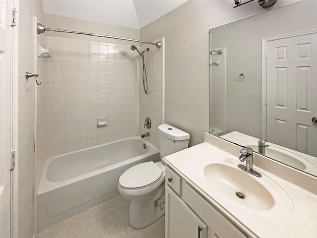 full bathroom with bathing tub / shower combination, toilet, vanity, and tile patterned flooring