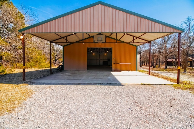 view of vehicle parking featuring a detached garage