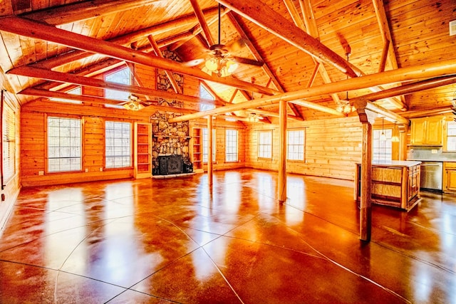 unfurnished living room featuring a wealth of natural light, beam ceiling, wood ceiling, and a ceiling fan