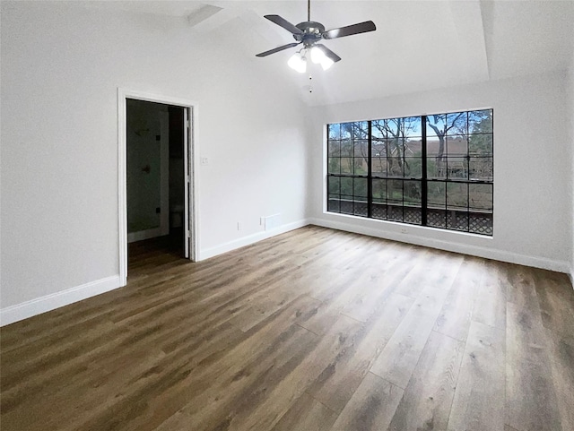 unfurnished room featuring wood finished floors, baseboards, high vaulted ceiling, beam ceiling, and ceiling fan