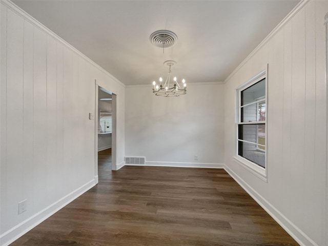 empty room with visible vents, a notable chandelier, dark wood-style flooring, and crown molding