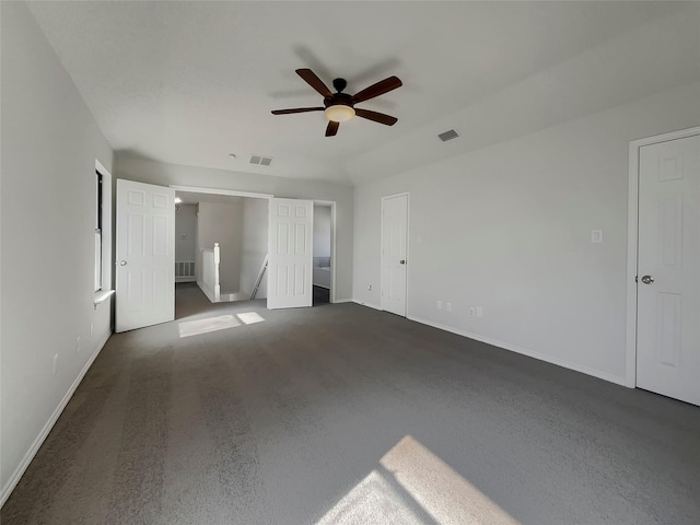 unfurnished bedroom featuring visible vents, baseboards, and ceiling fan