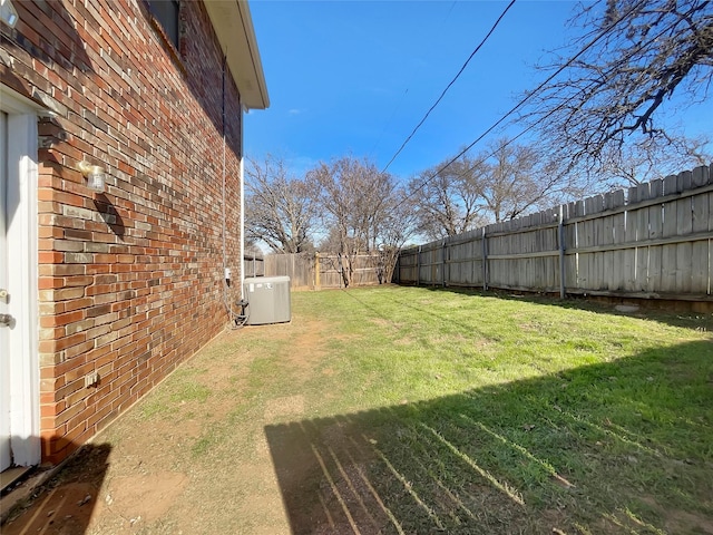 view of yard with a fenced backyard