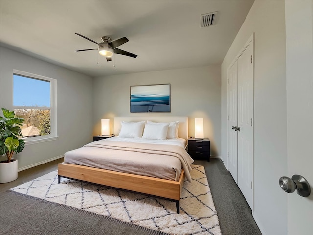 bedroom featuring visible vents, carpet floors, baseboards, and ceiling fan