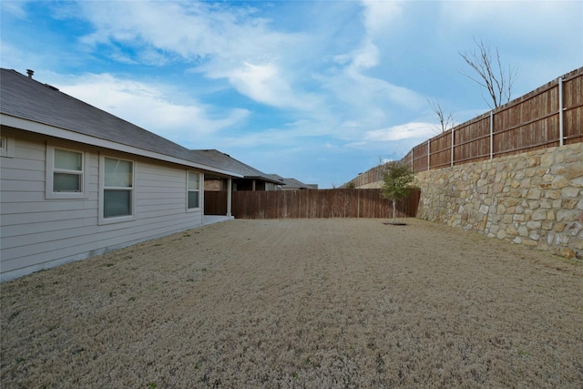 view of yard with a fenced backyard