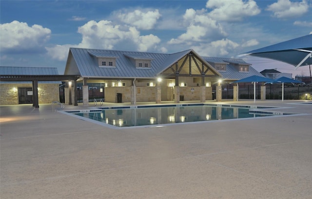 pool featuring a patio and fence