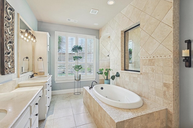 7300 Mitchell Ct, Lantana, TX 76226 - bathroom featuring a whirlpool tub, vanity, plenty of natural light, and tile patterned floors