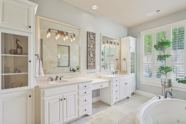 7300 Mitchell Ct, Lantana, TX 76226 - bathroom featuring vanity, a whirlpool tub, and plenty of natural light