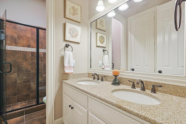 7300 Mitchell Ct, Lantana, TX 76226 - bathroom featuring a shower stall, double vanity, and toilet