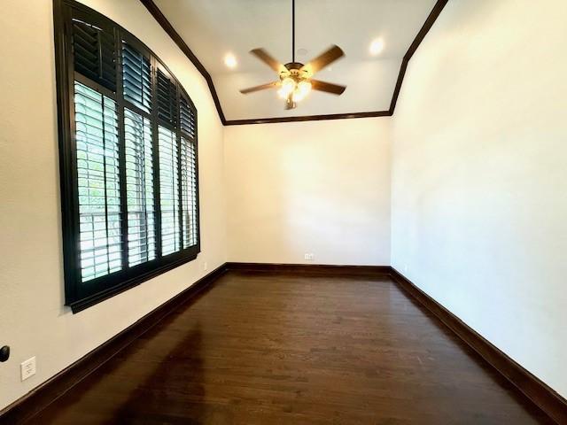 7300 Mitchell Ct, Lantana, TX 76226 - empty room with crown molding, wood finished floors, a ceiling fan, baseboards, and vaulted ceiling