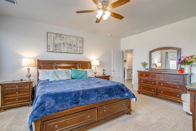 bedroom with light carpet and ceiling fan