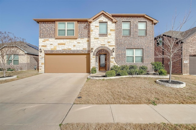 view of front of property with concrete driveway, an attached garage, and stone siding