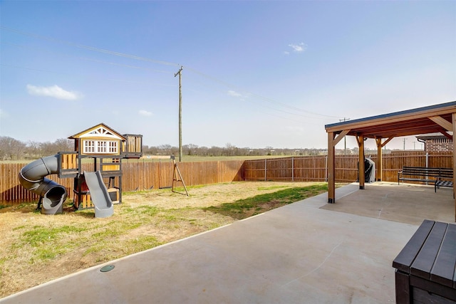 view of patio / terrace featuring a playground and a fenced backyard