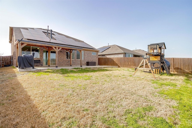 view of yard featuring cooling unit, a playground, a fenced backyard, and a patio area