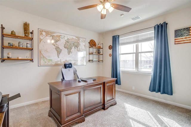 office area with visible vents, baseboards, and light colored carpet