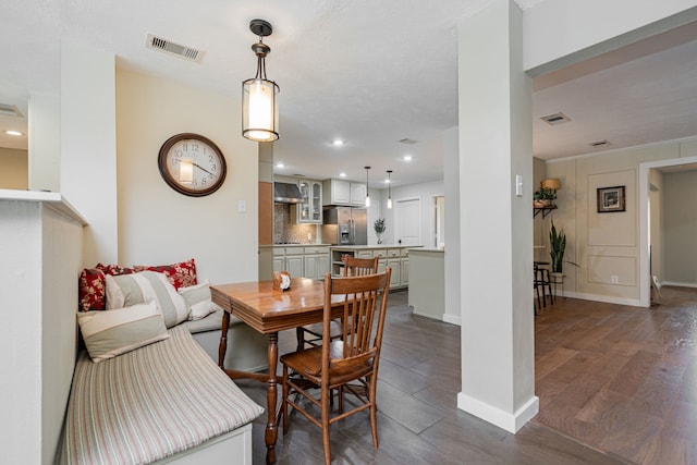 dining area with dark wood finished floors, recessed lighting, baseboards, and visible vents