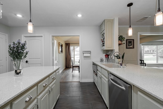 kitchen featuring a sink, light stone countertops, visible vents, and stainless steel dishwasher