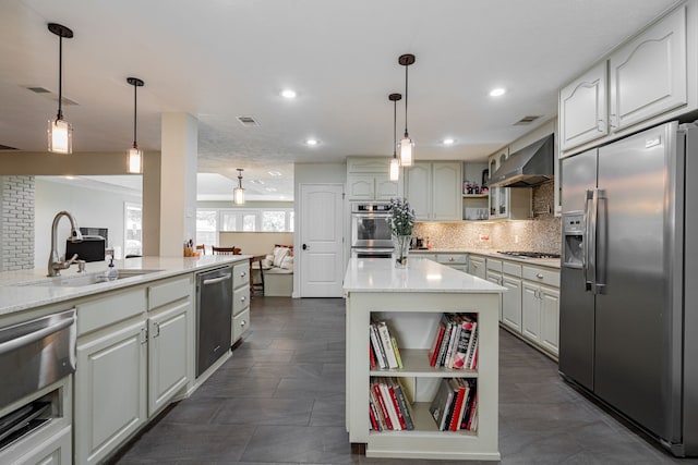 kitchen with open shelves, a sink, appliances with stainless steel finishes, wall chimney range hood, and tasteful backsplash