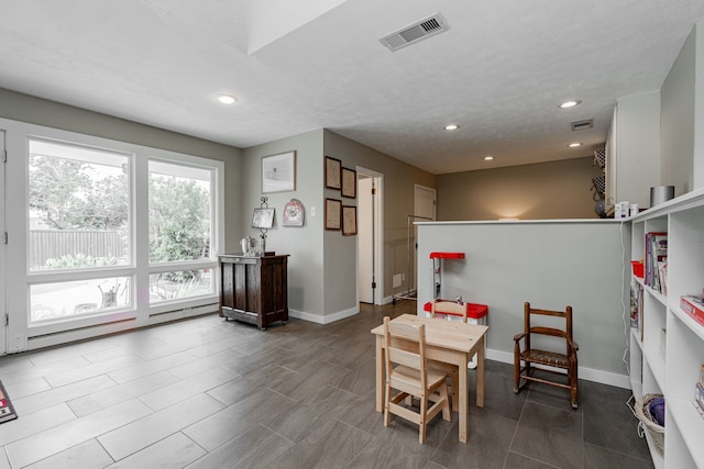 dining room featuring recessed lighting, baseboards, visible vents, and baseboard heating