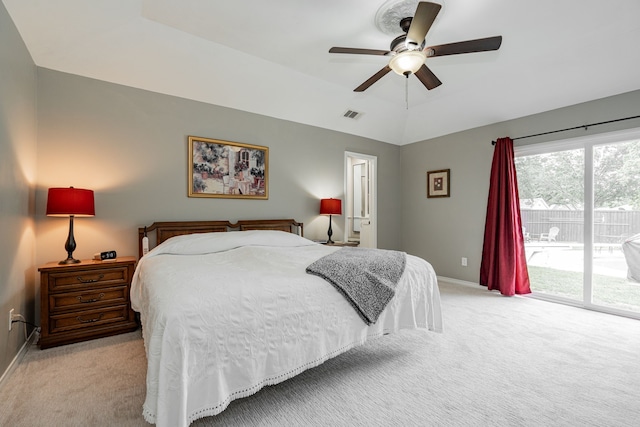 bedroom with visible vents, baseboards, light colored carpet, a ceiling fan, and access to outside