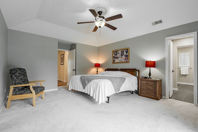 carpeted bedroom featuring a ceiling fan, lofted ceiling, baseboards, and visible vents