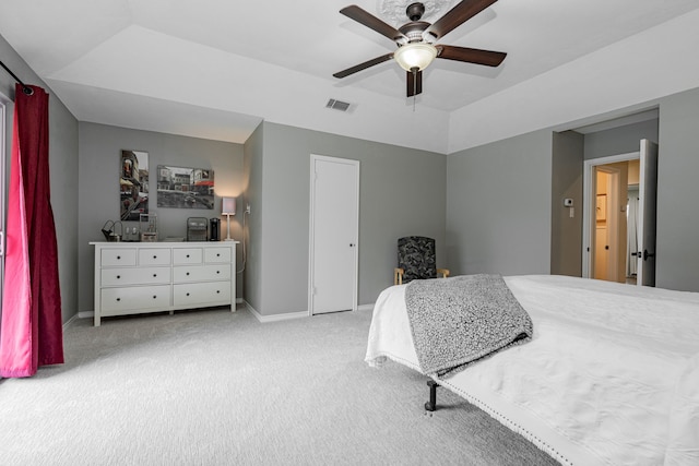 carpeted bedroom with visible vents, ceiling fan, baseboards, and vaulted ceiling