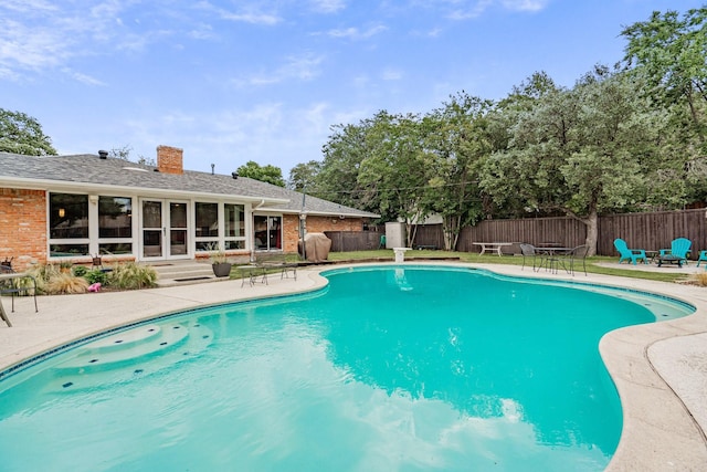 view of swimming pool with fence, a patio area, and a fenced in pool