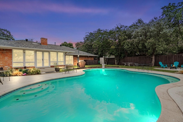 view of pool with a patio, a fenced in pool, and a fenced backyard