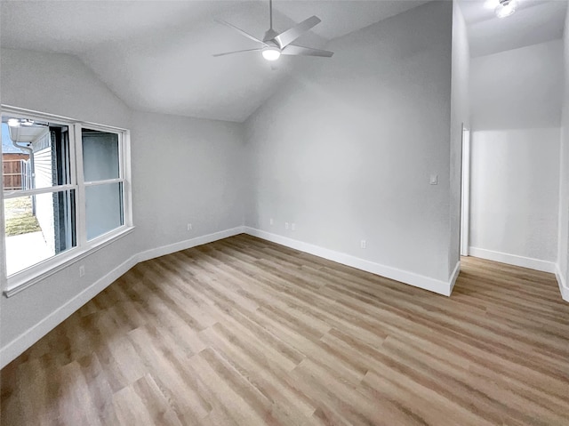 bonus room with a ceiling fan, vaulted ceiling, wood finished floors, and baseboards