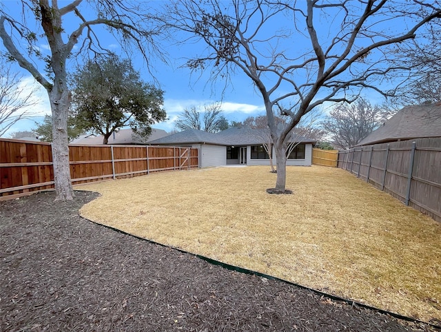 view of yard featuring a fenced backyard