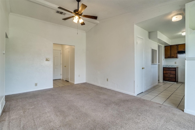 unfurnished living room with light carpet, visible vents, crown molding, and ceiling fan