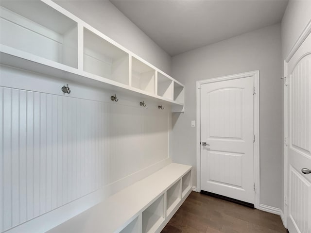 mudroom with baseboards and dark wood finished floors