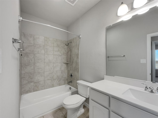 bathroom featuring tile patterned flooring, visible vents, toilet, bathing tub / shower combination, and vanity