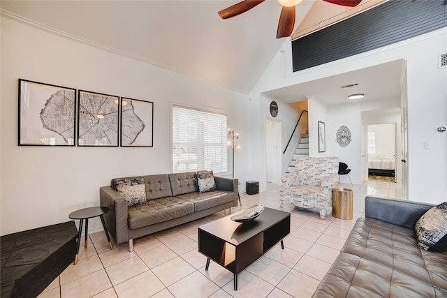 living area with visible vents, high vaulted ceiling, a ceiling fan, stairway, and light tile patterned floors